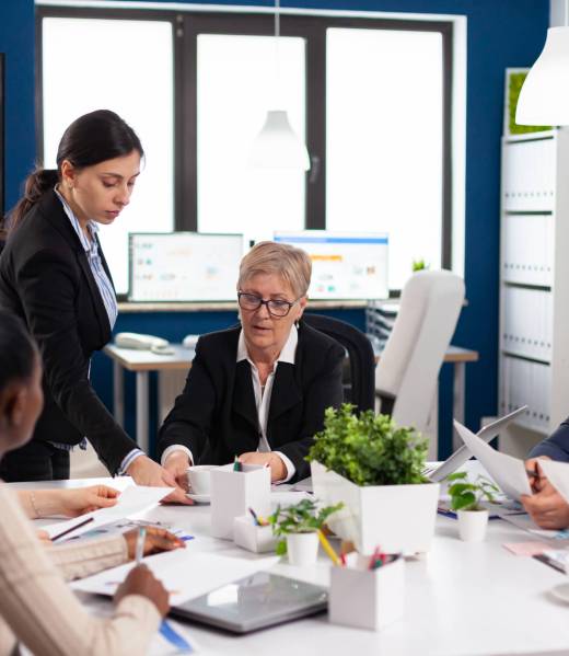 Group of businesspeople discussing talking working in conference room Multiethnic colleagues working planning success financial strategy discussing in office.